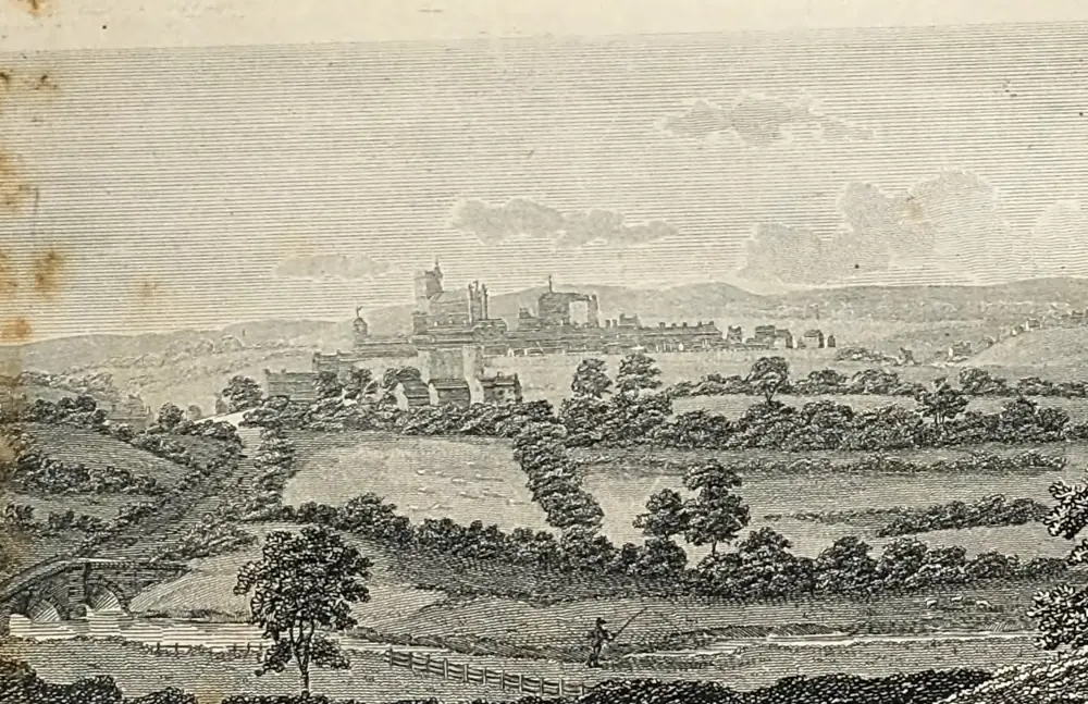 Engraving of open fields and hedges falling away to a river and a small bridge, with the walled city on the skyline beyond, the cathedral tower and the castle rising above a long line of roofs