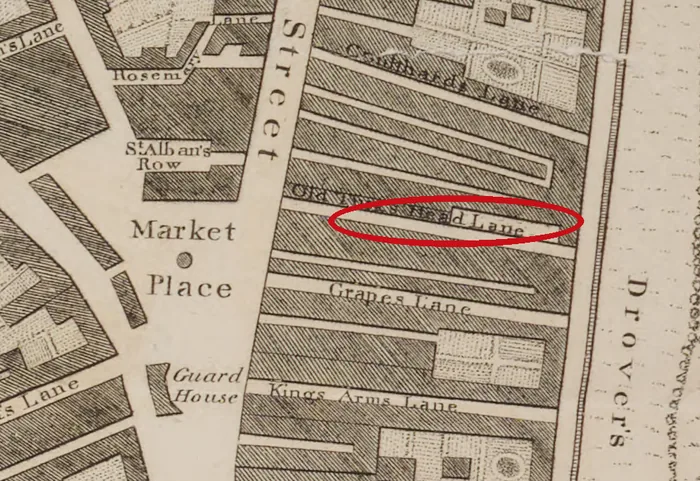 Engraved street plan of the east side of Scotch Street by the Market Place, with long narrow plots running east and a red ellipse round the engraved name Old Turk's Head Lane